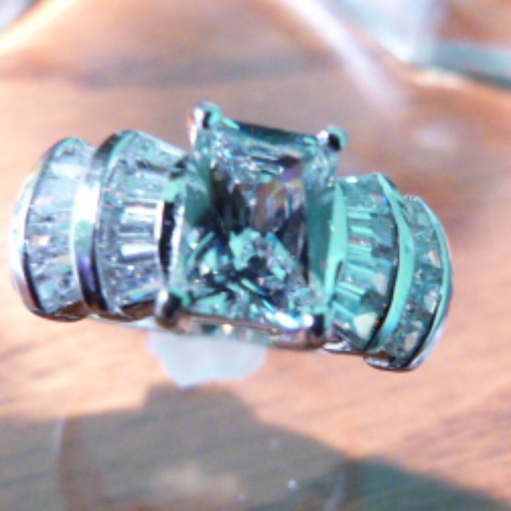 Emerald cut CZ with 20 Baguette stones